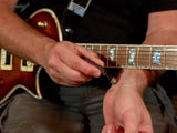 Guitar player applying Comfortably Numb oil on his wrist