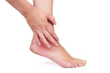 Sprained ankle pain being relieved by using Comfortably Numb pain reliever,