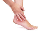 Sprained ankle pain being relieved by using Comfortably Numb pain reliever, 
